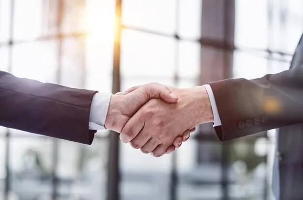 Business partners shaking hands